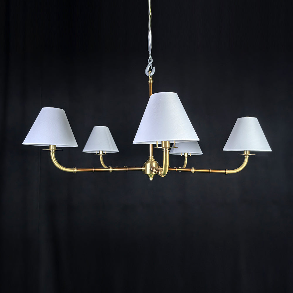 Gold chandelier with wide lampshades