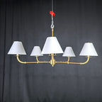 Gold chandelier with wide lampshades