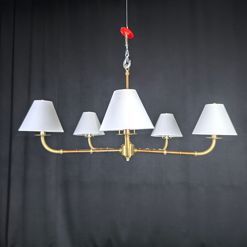 Gold chandelier with wide lampshades
